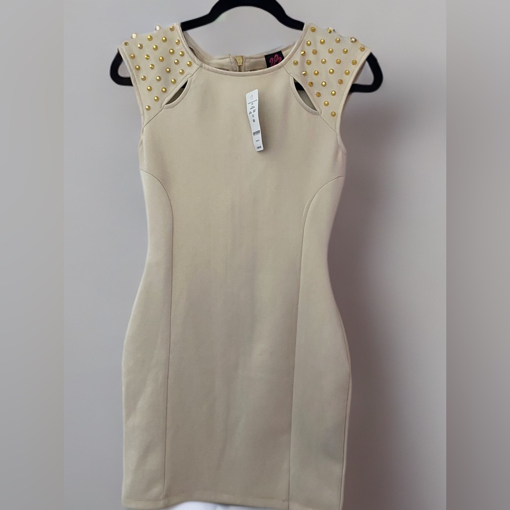 Bebe beige dress with gold studded detailing.
